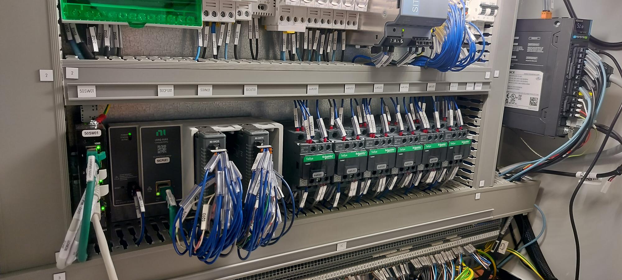 Test bench cabinet with NI CompactDAQ controller, I/O modules and electrical wiring